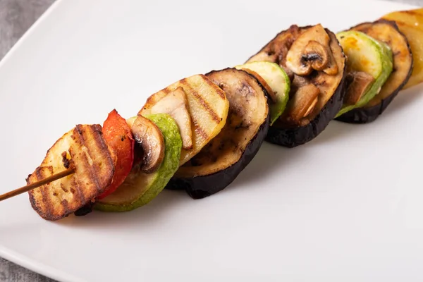 Grilled vegetable ratatouille on a white plate Royalty Free Stock Images
