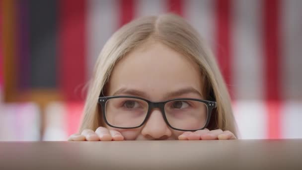 Close Eyes Cheerful Teenage Girl Eyeglasses Looking Hiding Desk Classroom — Stockvideo