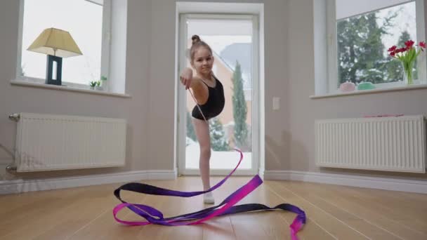 Slim Teen Girl Standing One Leg Twirling Gymnastic Ribbon Slow — Vídeo de stock