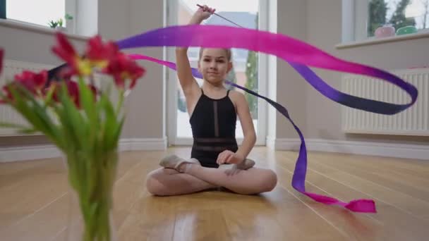 Beautiful Charming Teenage Girl Twirling Gymnastic Ribbon Smiling Sitting Floor — Stockvideo