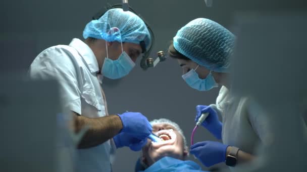 Side View Confident Concentrated Middle Eastern Dentist Injecting Anesthesia Talking — Video Stock