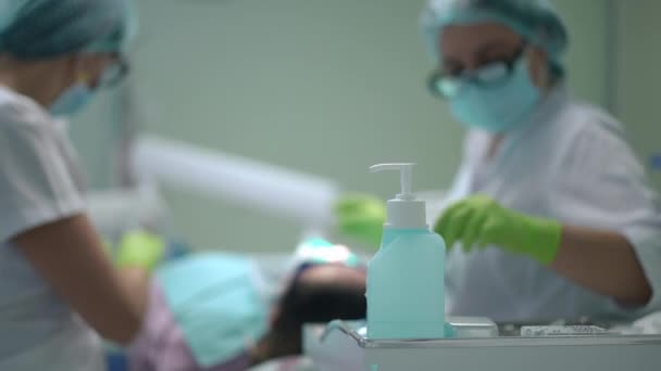 Disinfectant Dental Office Blurred Doctor Assistant Curing Patient Background Caucasian — Stockvideo