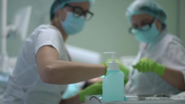 Close Sanitizer Dental Clinic Blurred Doctor Assistant Working Background Professional — Video