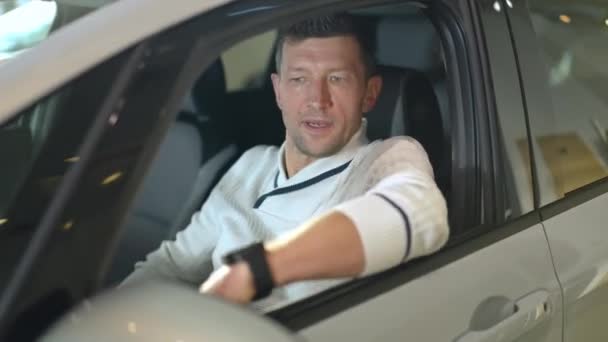 Portrait Satisfied Male Buyer Sitting Drivers Seat Luxurious New Automobile — Vídeos de Stock