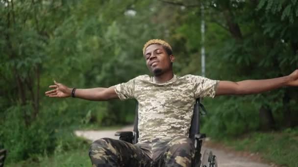 Happy Man Wheelchair Stretching Hands Closed Eyes Enjoying Tranquility Forest — Stockvideo