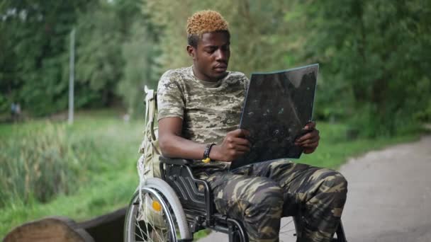 Sad Thoughtful Young African American Soldier Wheelchair Examining Ray Sitting — Vídeo de stock