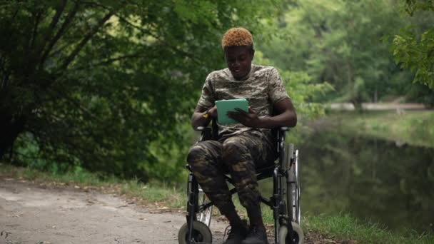 Smiling African American Man Wheelchair Surfing Social Media Tablet Sitting — Stockvideo