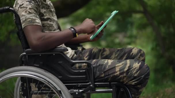 Side View Unrecognizable African American Man Wheelchair Messaging Online Tablet — kuvapankkivideo