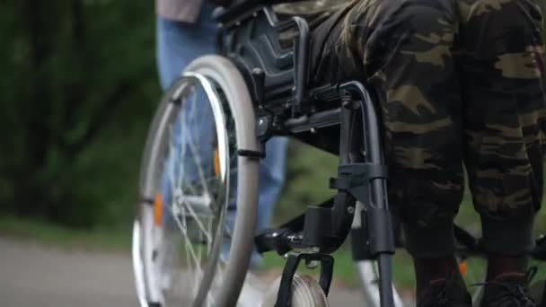 Legs Unrecognizable African American Soldier Wheelchair Caucasian Woman Pushing Mobility — Video