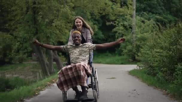 Joyful African American Man Wheelchair Stretching Hands Smiling Cheerful Caucasian — Vídeos de Stock