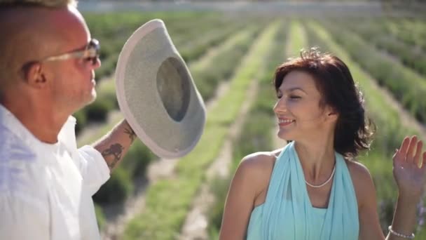 Beautiful Wife Sunshine Lavender Field Husband Putting Straw Hat Slow — стокове відео