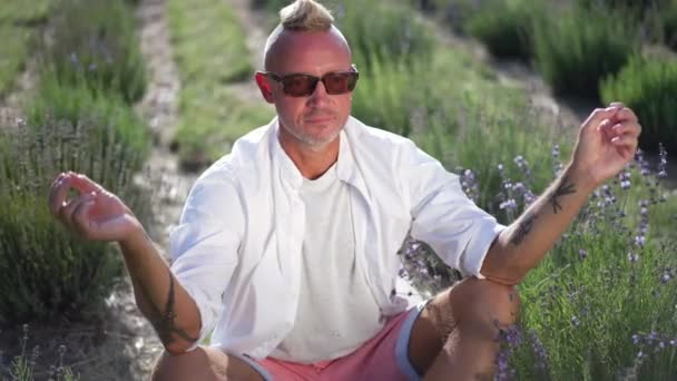 Adult Caucasian Man Closing Eyes Sitting Lotus Pose Lavender Field — Stockvideo