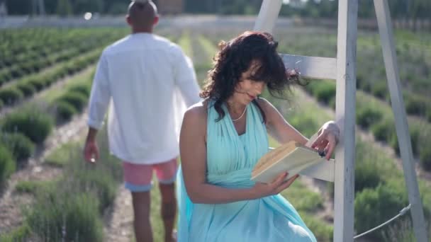 Caucasian Woman Reading Book Out Loud Slow Motion Lavender Field — Αρχείο Βίντεο