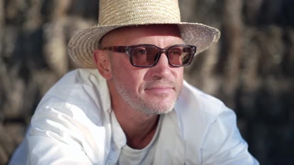 Headshot Portrait Satisfied Caucasian Man Straw Hat Sunglasses Looking Away — Stockvideo