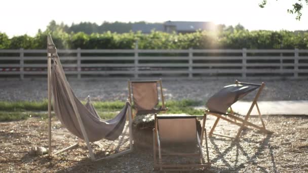 Wide Shot Rural Eco Resort Sunbeam Fabric Garden Chairs Hay — Vídeos de Stock