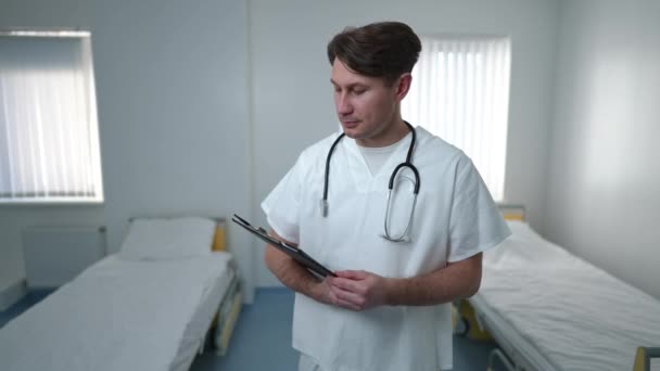 Medium Shot Intelligent Positive Caucasian Male Doctor Standing Hospital Ward — Stockvideo