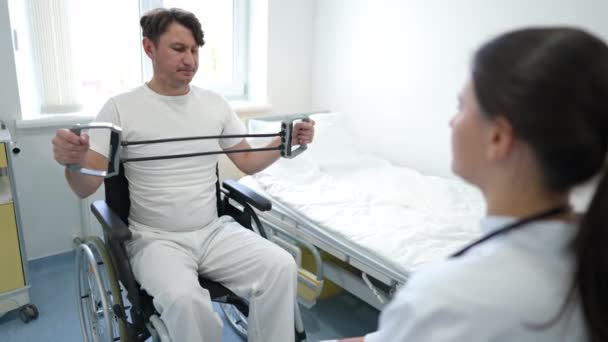 Weak Motivated Caucasian Man Exercising Resistance Band Sitting Wheelchair Blurred — Stok video