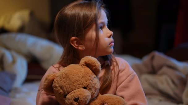 Close Frightened Cute Girl Bomb Shelter Hugging Teddy Bear Looking — Stockvideo