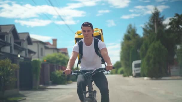 Front View Focused Courier Bicycle Riding Sunny Suburban Street Outdoors — Αρχείο Βίντεο