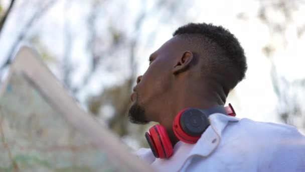 Close Curios Young African American Man Paper Map Standing Autumn — Stock video