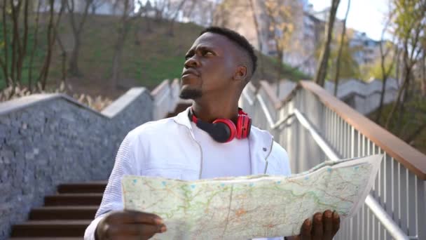 Portrait Unsure Young African American Man Paper Map Standing Park — Stock videók