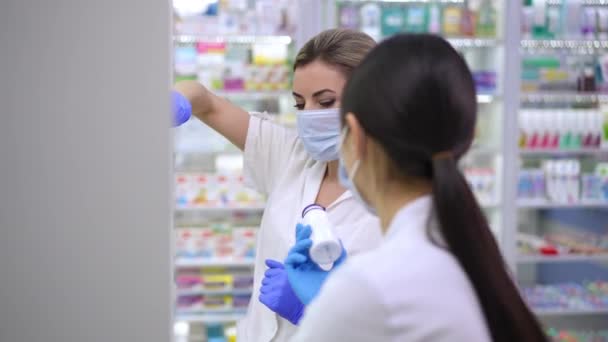 Concentrated Caucasian Asian Pharmacists Checking Pills Shelves Drugstore Talking Side — Stockvideo