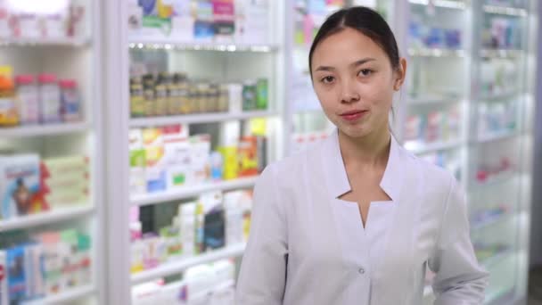 Young Asian Woman Uniform Standing Right Pharmacy Crossing Hands Looking — Vídeo de Stock