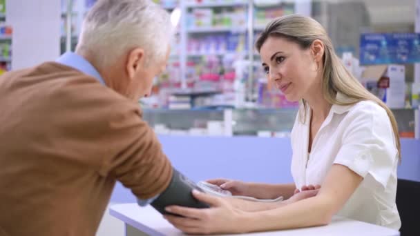 Portrait Positive Woman Supporting Senior Man Talking Measuring Blood Pressure — Stock Video