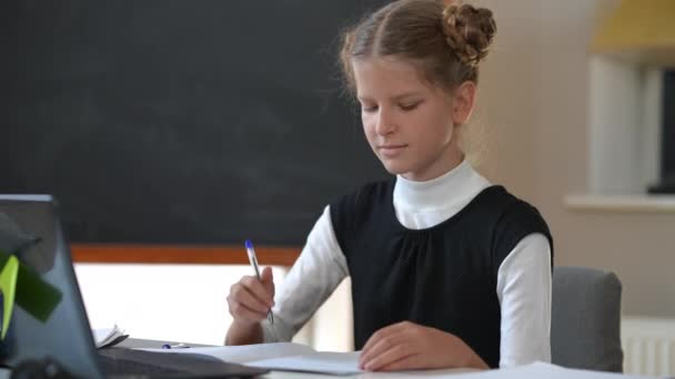 Smart Confident Teenage Schoolgirl Watching Online Lesson Writing Pen Sitting — 图库视频影像