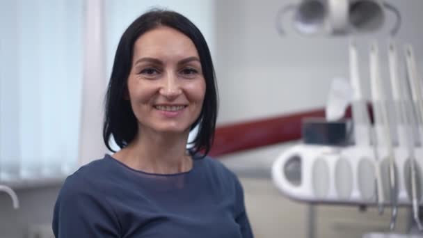 Portrait Confident Satisfied Caucasian Woman Looking Camera Sitting Dental Chair — Stok video