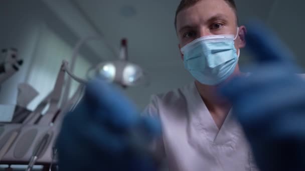 Portrait Focused Concentrated Dentist Using Tools Treating Patient Slow Motion — Stok video
