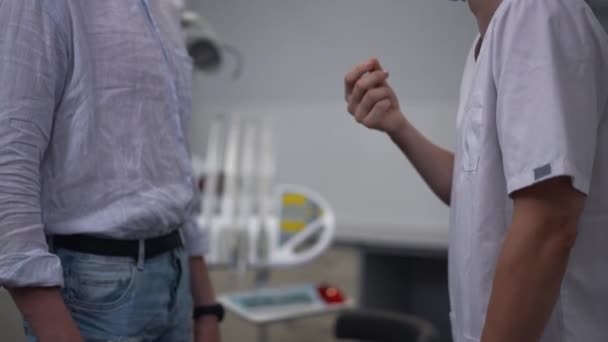 Side View Unrecognizable Dentist Patient Handshaking Slow Motion Standing Indoors — 비디오