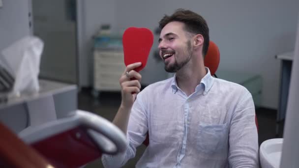 Medium Shot Portrait Happy Man Admiring Teeth Looking Hand Mirror — Stockvideo