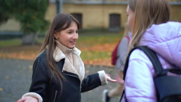 Smiling Cute Teenage Girl Talking Friend Schoolyard Gesturing Sharing Rumors — Stockvideo