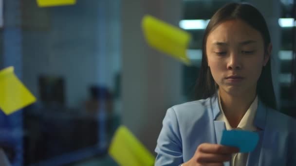 Dissatisfied Displeased Asian Woman Tearing Adhesive Notes Glass Sighing Portrait — Vídeo de Stock