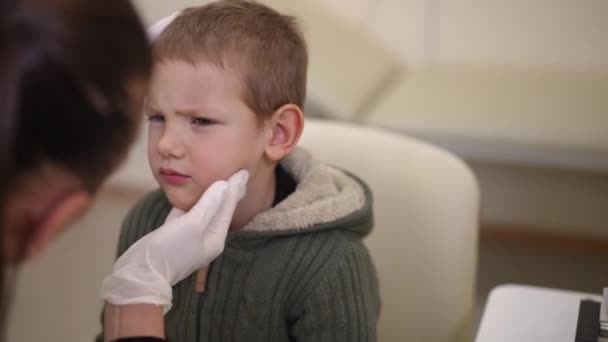 Sad Dissatisfied Boy Painful Eye Visit Doctor Visually Examining Pupil — Stockvideo