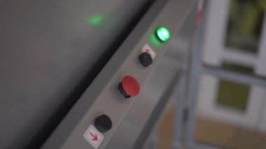 Close-up buttons panel in lift for people with disabilities indoors. Modern high-quality accessibility equipment with no people