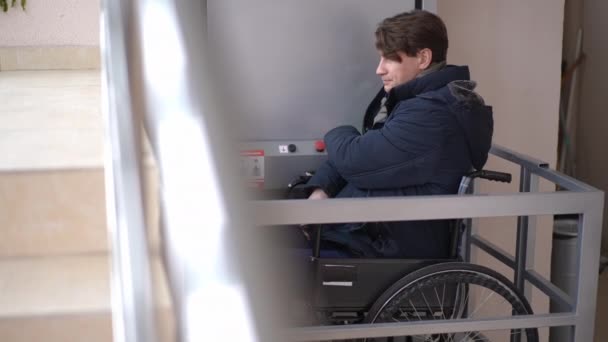Live Camera Follows Man Wheelchair Pushing Button Moving Elevator Hospital — Video