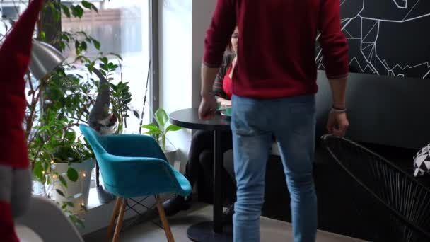 Wide Shot Arrogant Woman Sitting Cafe Ignoring Man Entering Hugging — Stockvideo