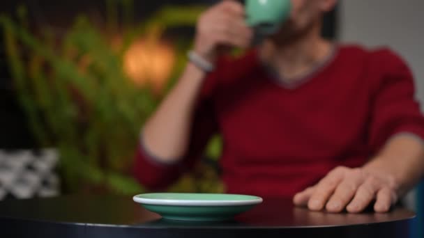 Blurred Unrecognizable Man Drinking Coffee Sitting Table Putting Cup Plate — Stok video