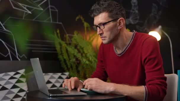 Intelligent Concentrated Man Surfing Internet Laptop Drinking Coffee Cafe Indoors — Vídeo de Stock