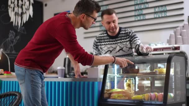 Caucasian Adult Man Choosing Dessert Coffee Shop Talking Cashier Indoors — Video