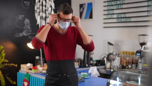 Caucasian Male Barista Taking Covid Face Mask Crossing Hands Looking — Stockvideo