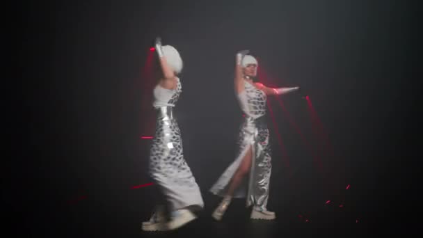 Two Slim Beautiful Women Futuristic Costumes Laser Beams Dancing Changing — Stockvideo