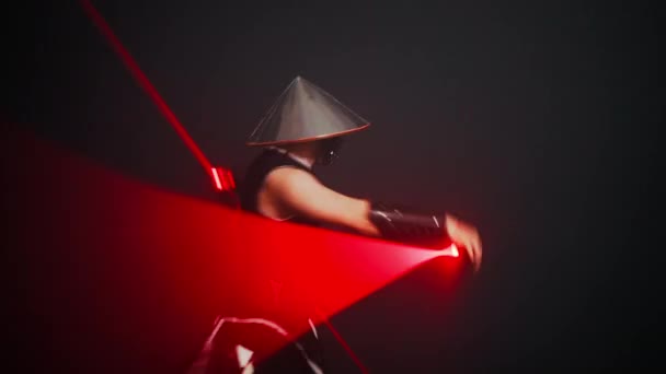 Talented Man Futuristic Samurai Costume Neon Lights Performing Black Background — Stockvideo