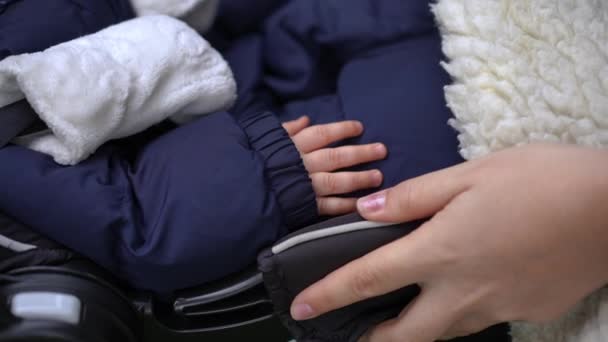 Close Female Caucasian Hand Shaking Baby Stroller Tiny Palm Newborn — стокове відео