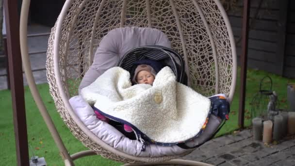 Wide Shot Hanging Chair Patio Sleeping Infant Dreaming Portrait Calm — Stockvideo