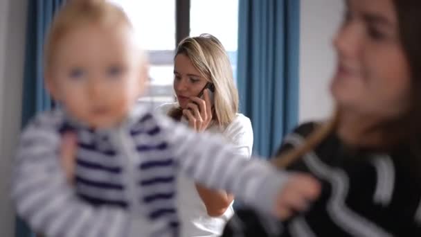 Busy Mother Talking Phone Blurred Friend Playing Daughter Front Portrait — Stok video