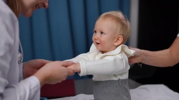 Smiling Baby Girl Looking Doctor Shaking Hands Talking Adorable Kid — Stok Video