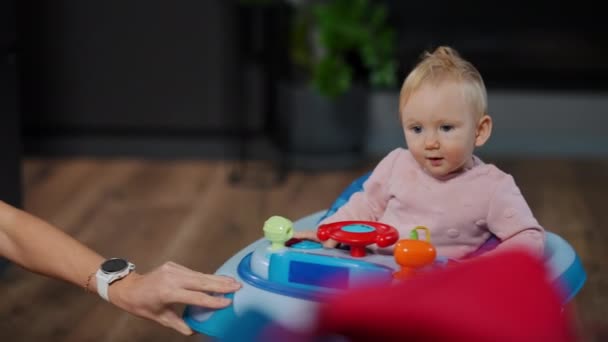 Baby Girl Walker Female Hand Riding Device Slow Motion Indoors — Stock videók